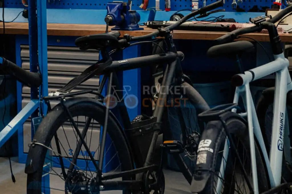 A group of bikes parked in a garage.