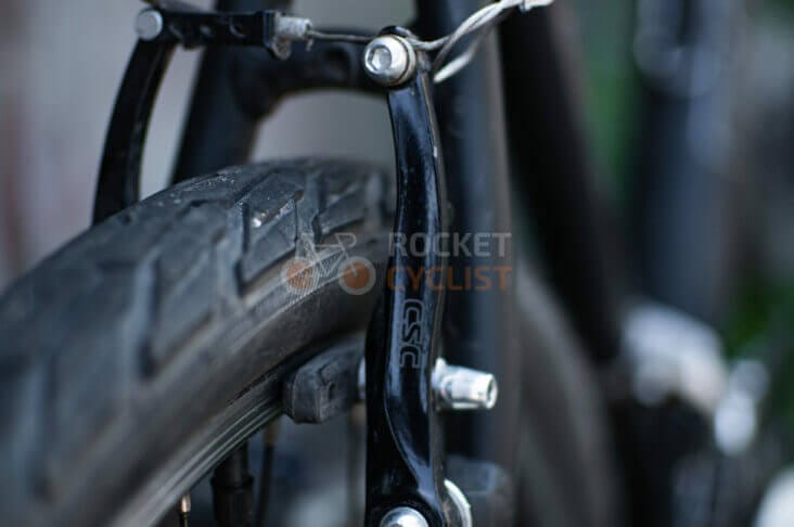 A close up of a bicycle's front brake.