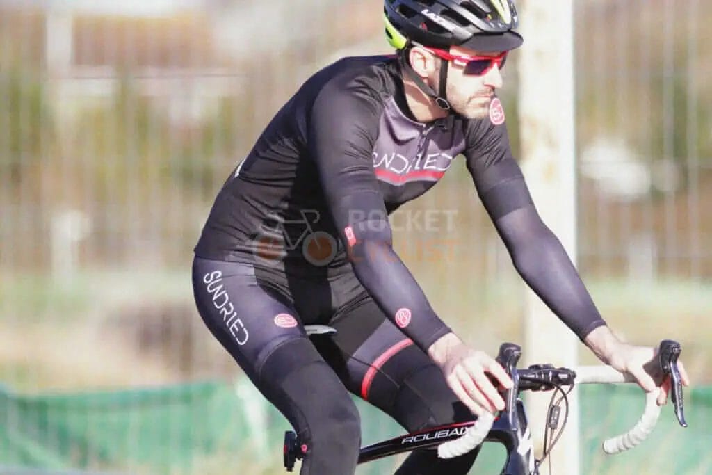 A man riding a bike on a track.