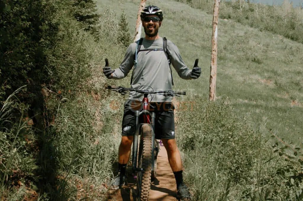 A man riding a mountain bike on a trail.