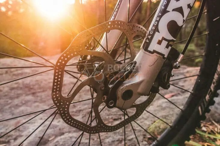 A close up of a mountain bike with a disc brake.