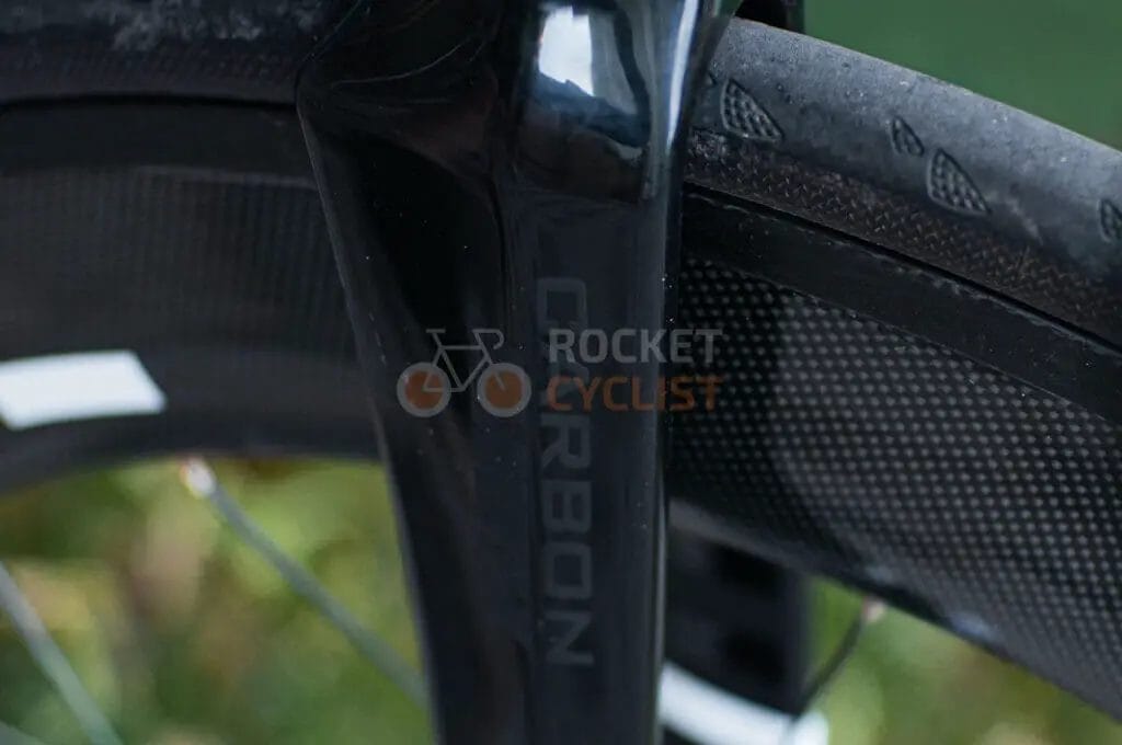 A close up of a bicycle tire with a logo on it.