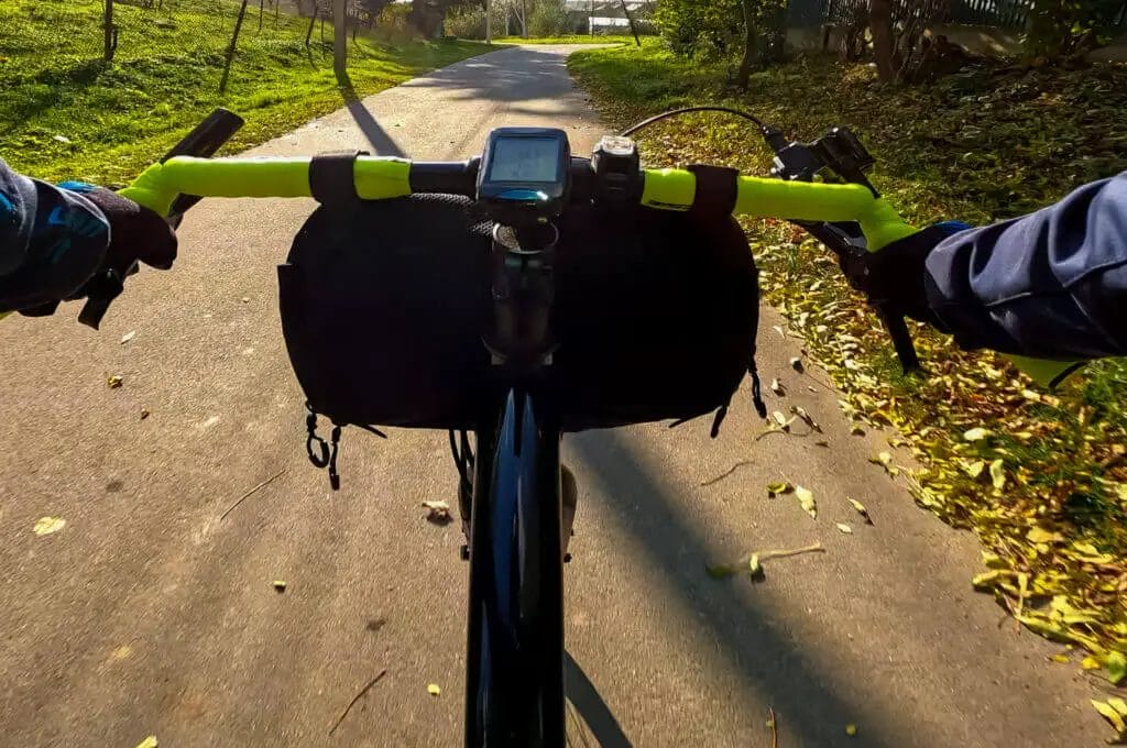 A person riding a bike on a paved path.