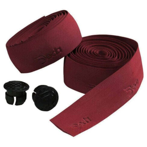 A pair of burgundy bike handlebar tapes.