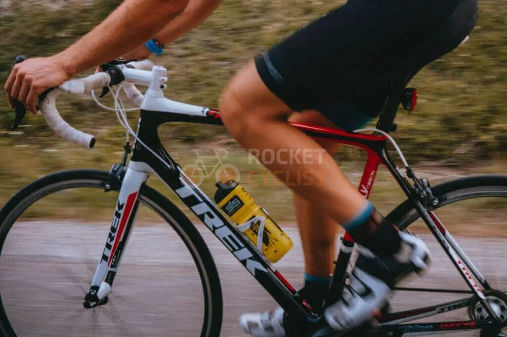 A person riding a bike on a road.