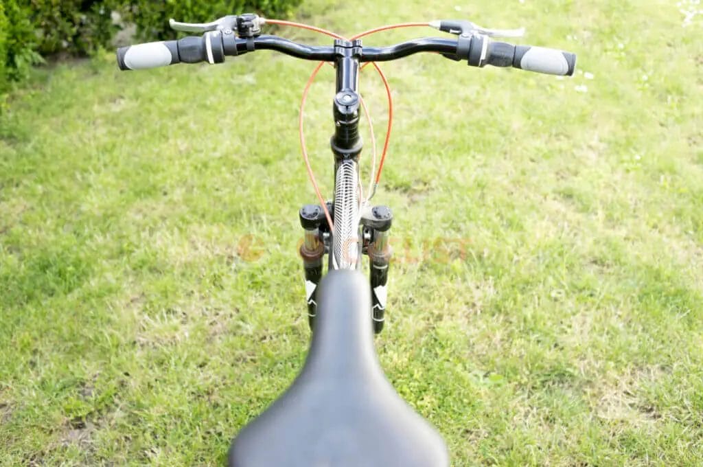 A close up of the handlebars of a bicycle.