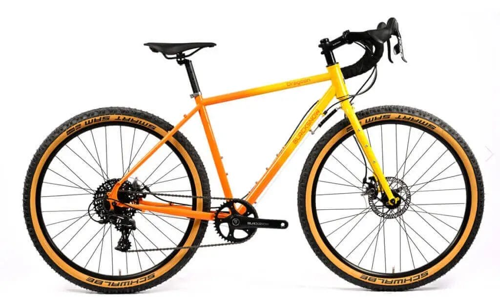 An orange and yellow bike against a white background.