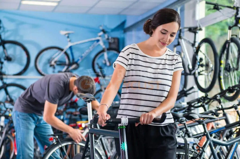 A woman and a man in a bicycle shop.