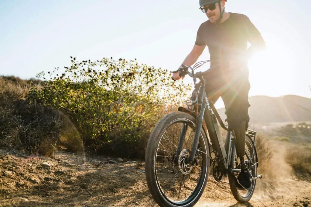 A man riding a mountain bike on a dirt trail.