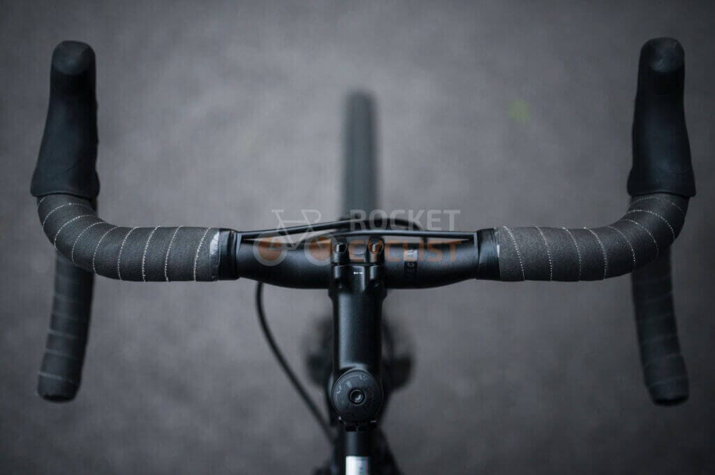 A close up of the handlebar of a bike.