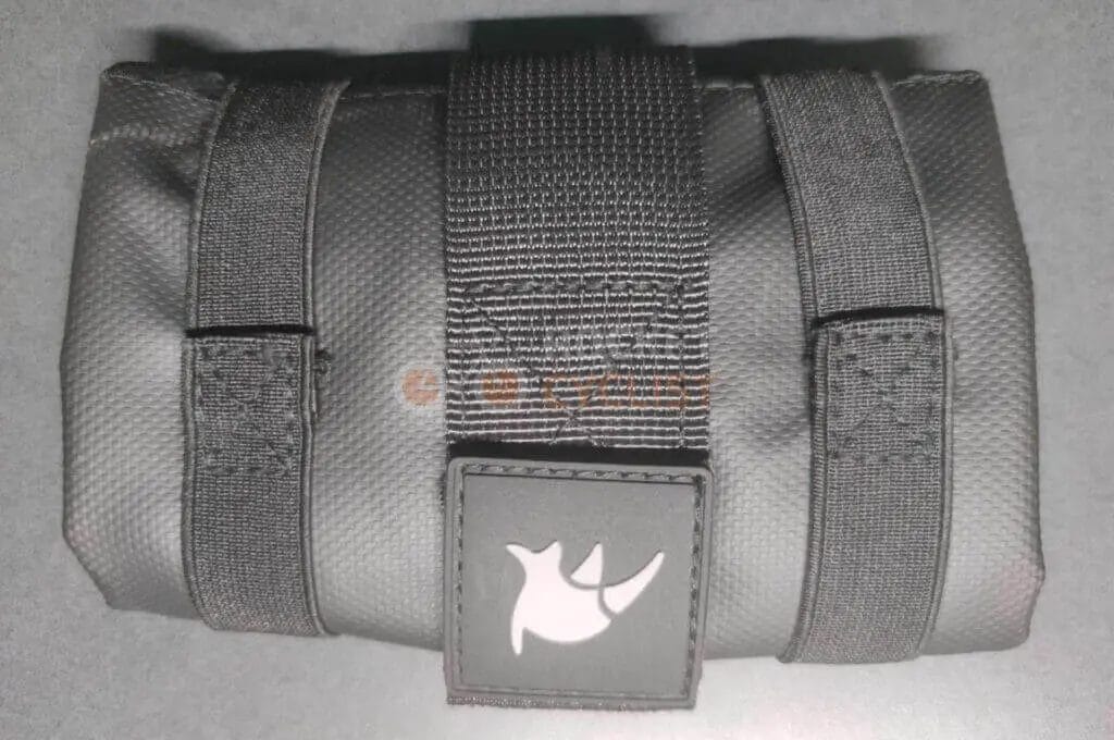 A black pouch with a logo on it.