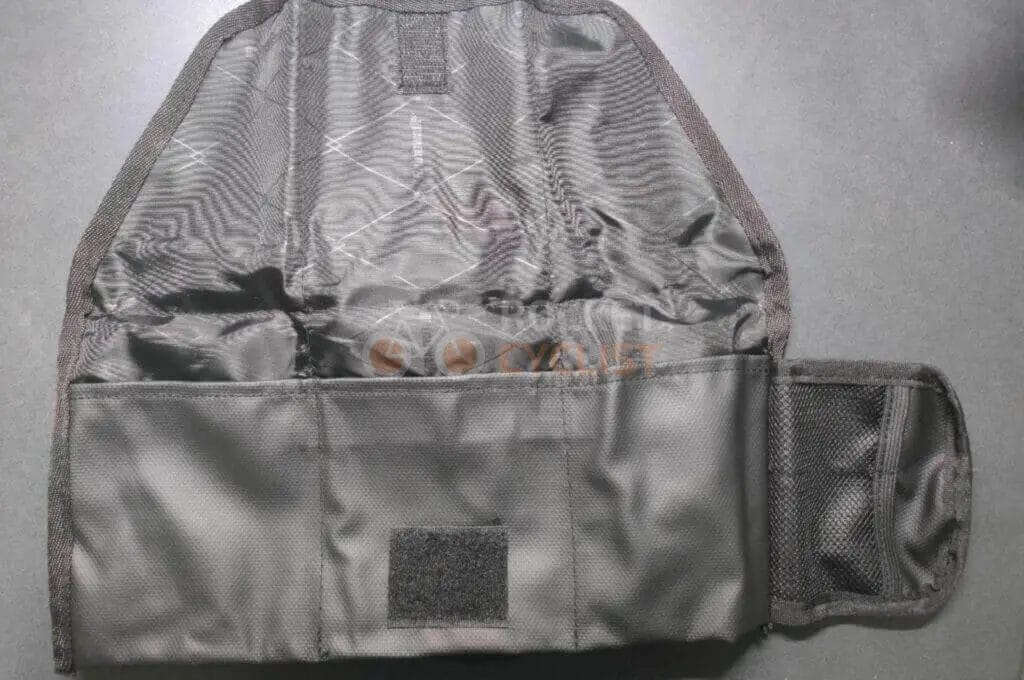 A black pouch with a zipper on it.