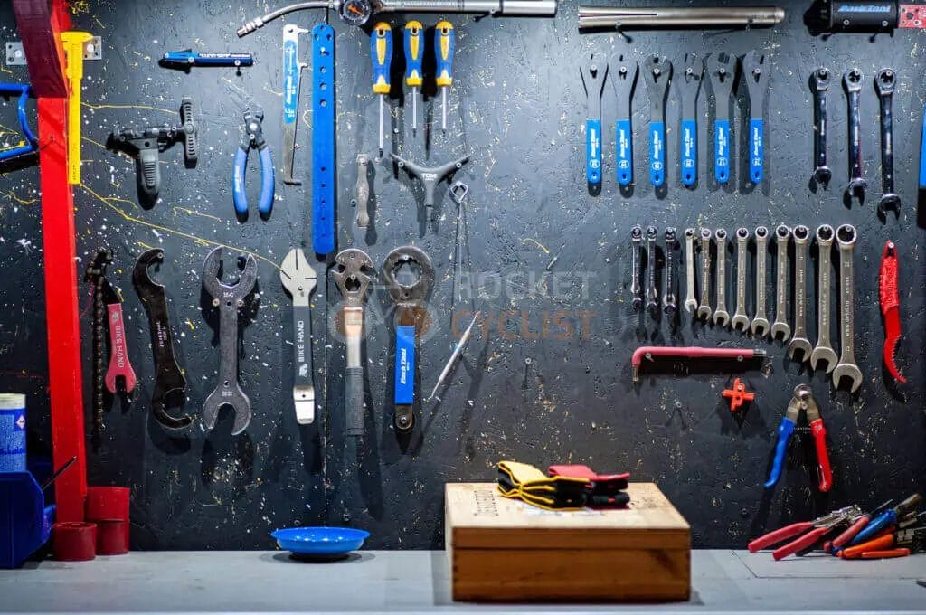 A wall of tools in a garage.