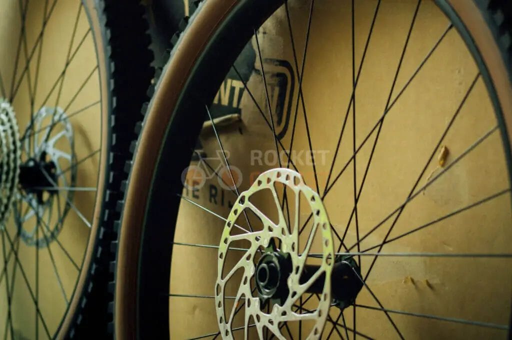 A pair of mountain bike wheels on a cardboard box.
