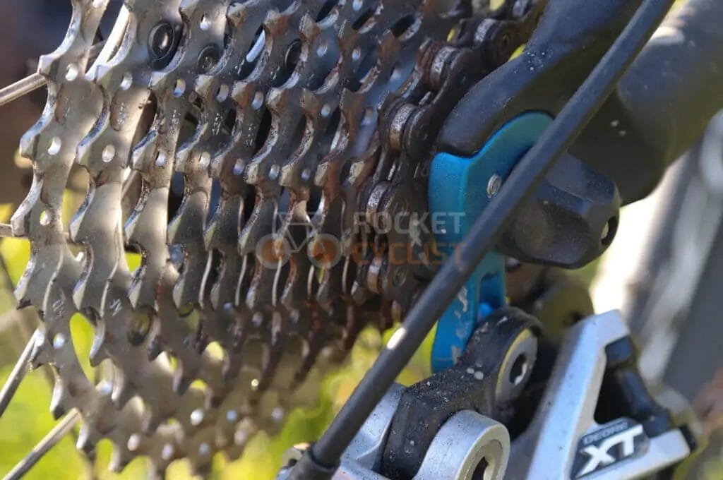 A close up of a bicycle chain and chainring.