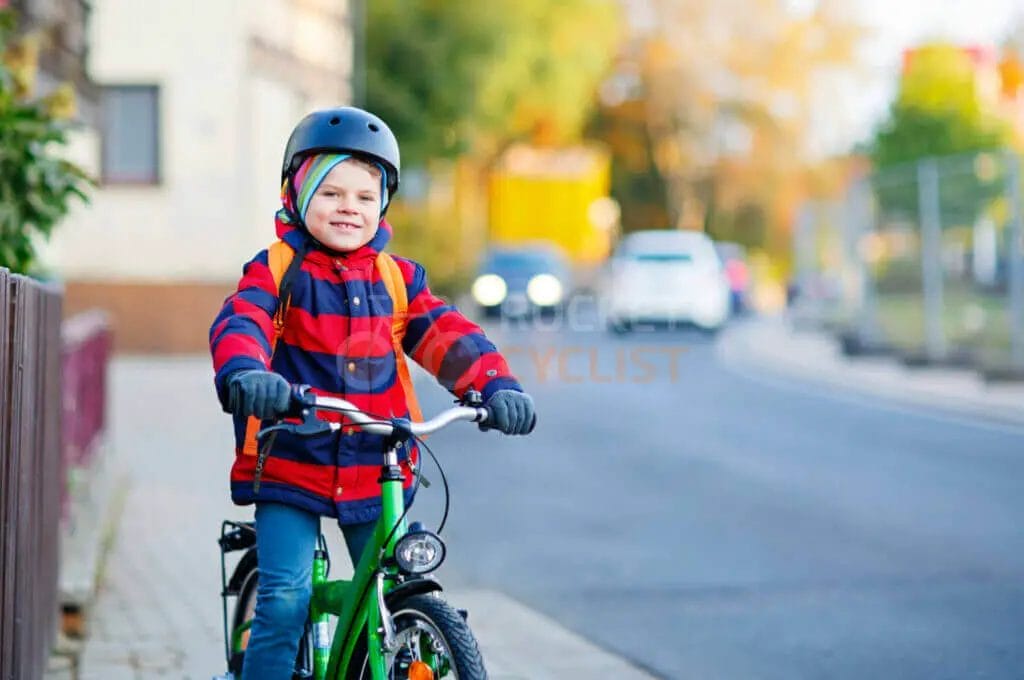 A child on a bike.